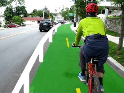Rendering of a protected bicycle lane that's drawn on top of a photograph of a guy cycling into an intersection.